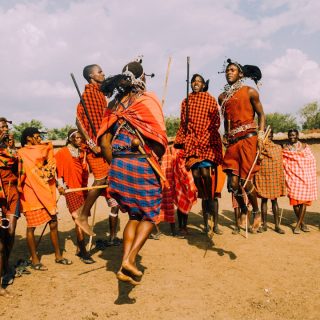 a group of people standing around each other