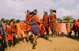 a group of people standing around each other