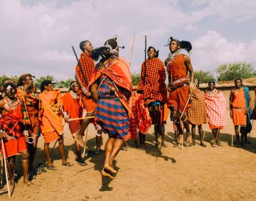 a group of people standing around each other