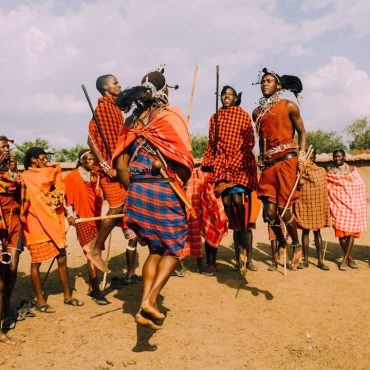 a group of people standing around each other
